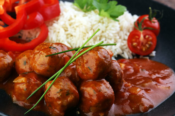 Delicious meatballs made from ground beef in a spicy tomato sauce