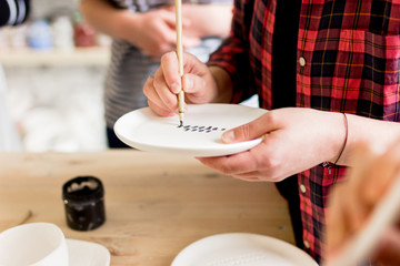 workshop production of ceramic tableware product painting