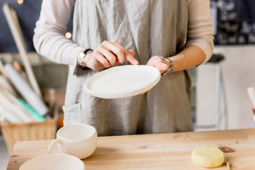 workshop production of ceramic tableware product painting