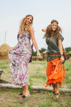Young girls in hippie style having fun