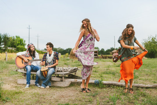 Young group of friends in hippie style having fun