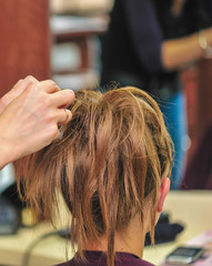 Fototapeta premium Hairdresser applying hair gel