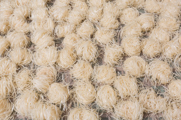 Fresh made rice noodles to dry