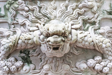 Marble carving on a wall at marble mountain