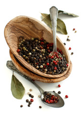 Peppercorn mix in a bowl and bay leaves