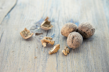 Dried walnuts on rustic wooden table