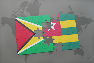 puzzle with the national flag of guyana and togo on a world map