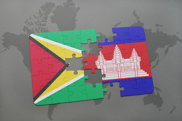 puzzle with the national flag of guyana and cambodia on a world map