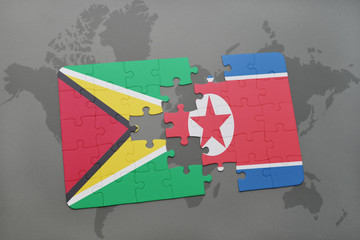 puzzle with the national flag of guyana and north korea on a world map