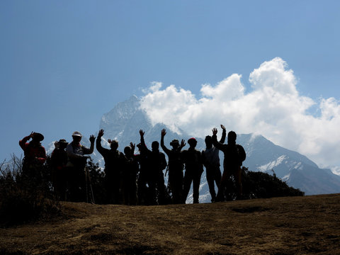 Silhouette Of Trekkers Waving - Himalayas