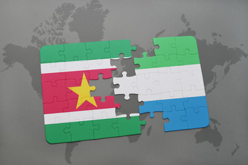 puzzle with the national flag of suriname and sierra leone on a world map