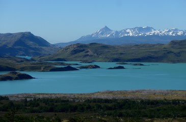 Obraz premium The majestic views of Southern Patagonia, a bright blue lake in the beautiful Torres del Paine National Park