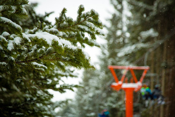 Ski chairlift with skiers and snowboarders