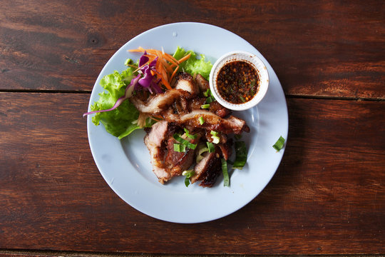 Thai street food grilled pork with spicy sauce