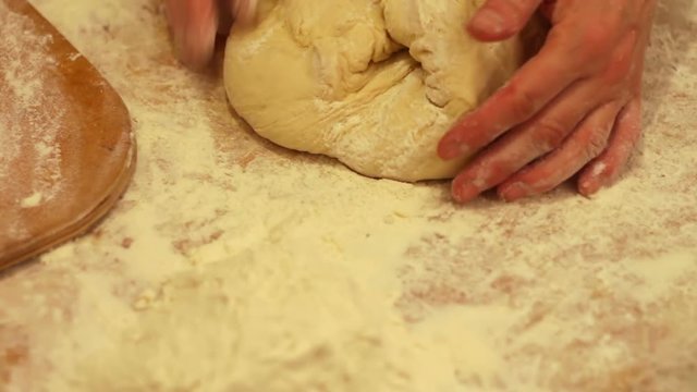 Woman working with dough. making homemade croissants