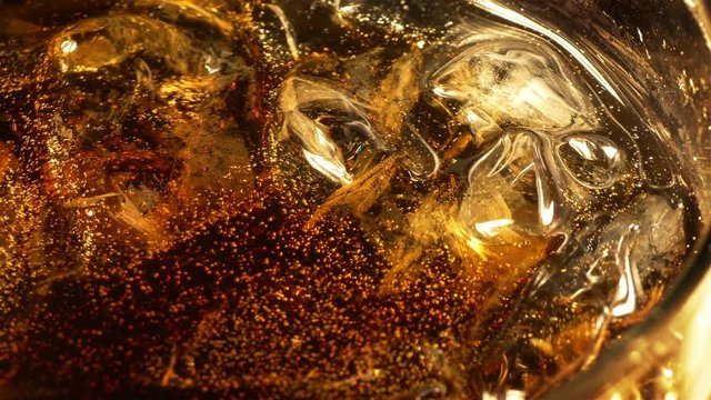 Two high quality videos of cold cola with bubbles in 4K