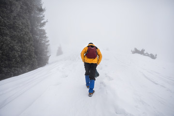 Tourist in the snowy mountains