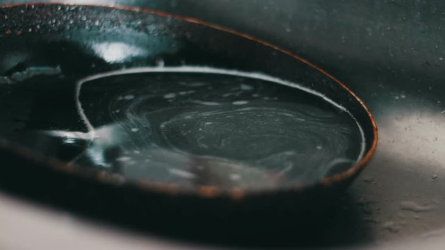 Dirty pan lies in the kitchen sink