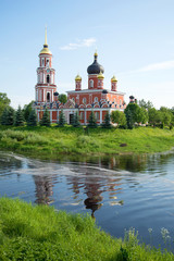 Naklejka premium View of Resurrection Cathedral on the river bank Polist in the sunny June afternoon. Staraya Russa, Russia