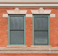 Green Windows in Brick Wall with Art Deco Trim