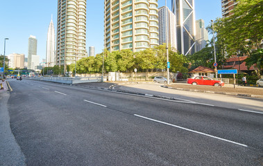 Naklejka premium Empty asphalt road and modern buildings in Kuala Lumpur,Malaysia.