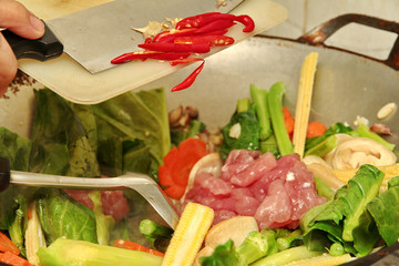 Cooking ,Fried big noodle with pork,vegetable in soup .