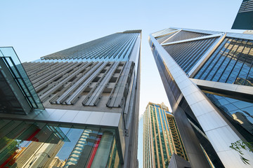 Low angle shot of modern glass city buildings with clear sky background. KL,Malaysia. © jamesteoh.art