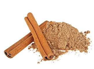 Cinnamon sticks and powder on a white background
