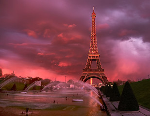 Eiffel tower on a sunset half-lit with last rays of the setting sun