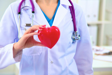 Close-up of unknown female doctor with stethoscope isolated