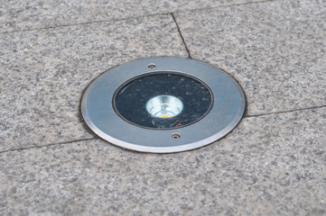 Outdoor Lighting. Garden lighting installed in stone pavement. Stone path to the house with night...