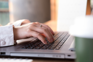 hand of women use a  laptop in business concept