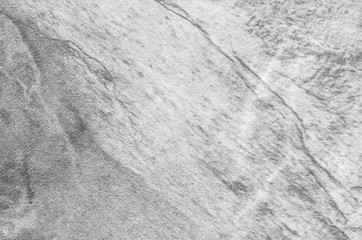 Closeup surface at stone pattern at stone brick wall in the garden textured background in black and white tone
