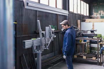 Side view of man working with bikes details