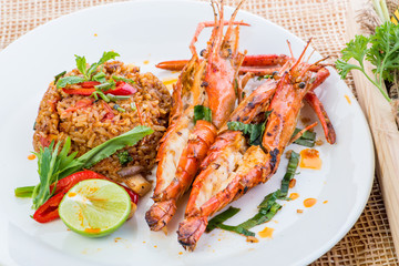Asian fried rice nasi goreng with chicken, prawns, egg and vegetables, Thai cuisine