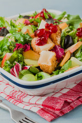 French salad with baked camembert, cranberries and fresh fruit.