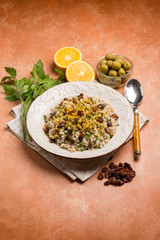 barley risotto with dried grape green olives and grated orange peel