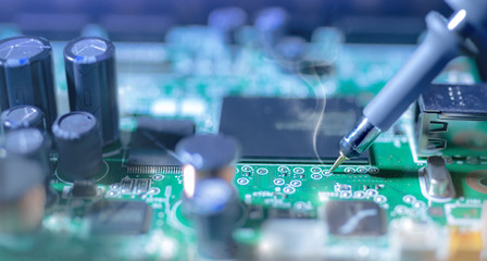 Electronic background: soldering of computer motherboard