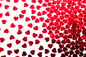 Valentine's day  decorative pattern red hearts confetti isolated on white background. Festive valentine backdrop.