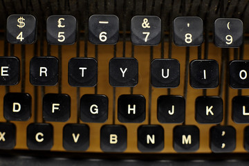 black vintage typewriter close up on keys.