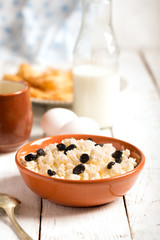 Cottage cheese with raisins and eggs. Vertical orientation