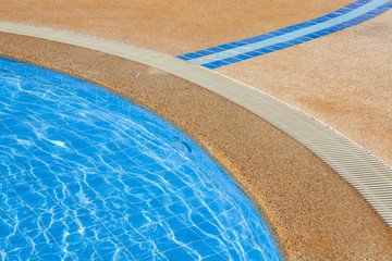 Fototapeta na wymiar swimming pool edge with drainage ditch