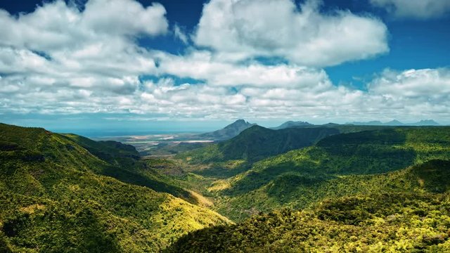 Cloud shadows over tropical rainforest covered hills timelapse. Black River Gorges National Park, Mauritius.