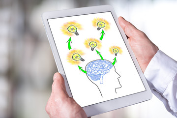 Human brain ideas concept on a tablet