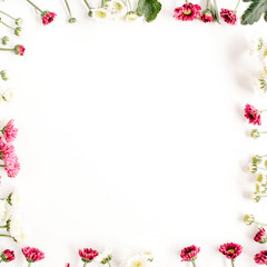 Wreath frame of red and white wildflowers, green leaves, branches on white background. Flat lay, top view. Valentine's background