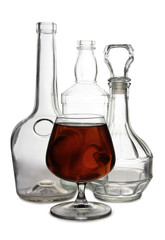 Glass with brandy and cognac on white background