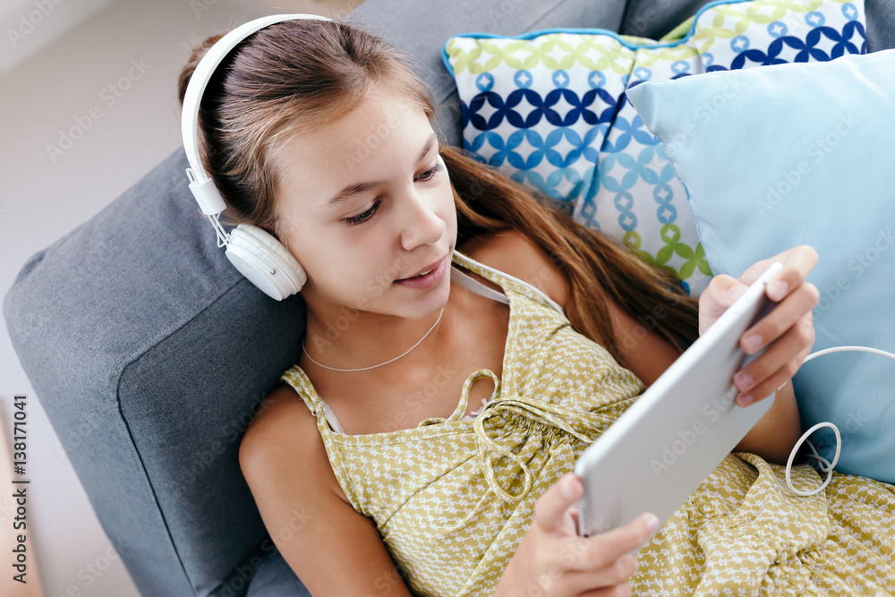 Sticker Tween girl relaxing on couch at home