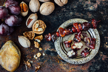 Sweet churchkhela with ingredients.