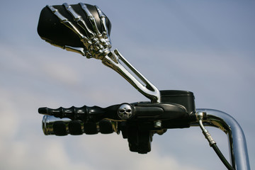 chrome metallized motorbike handlebar with the mirror