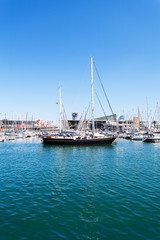 Fototapeta na wymiar Port of Barcelona. Harbor with luxury yachts parked in the city center